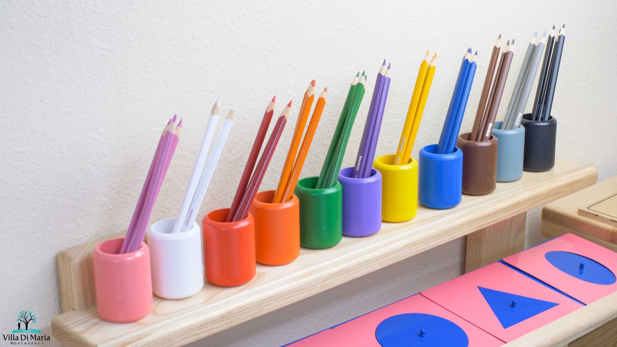 Color pencils in their respective pen holders