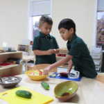 Two boys learning how to cut vegetables (150x150)