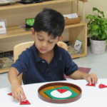 A child completing a circle puzzle (150x150)