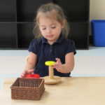 A child playing tower of Hanoi