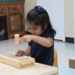 A little girl hammering a nail (150x150)