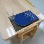 A table with tableware set up for eating (150x150)