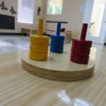 Colored rings to be put on small poles, like tower of Hanoi (150x150)