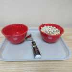 Two bowls, one empty and one filled with seeds (150x150)